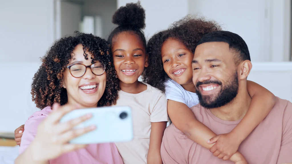 Happy multicultural family smiling together outdoors - Family Immigration Services